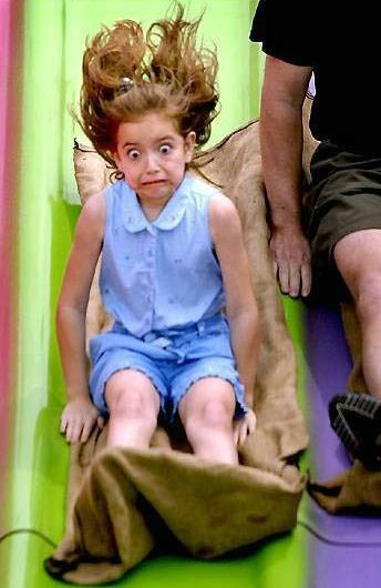 Child Staring While Sliding Down - Funny Pictures and Images